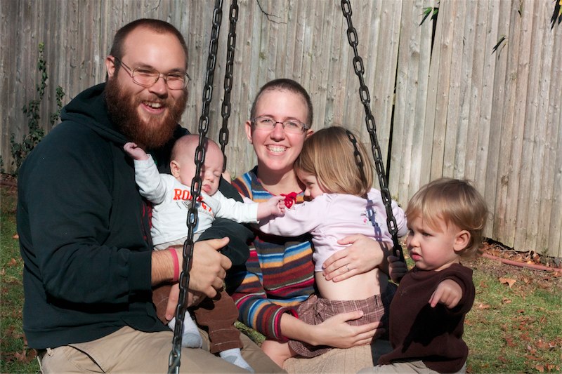 Family pic on tire swing