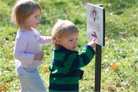 Pic of kids pointing at tree house sign 22-05-2011