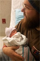 Pic of Tim holding baby Noah 02-23-2011